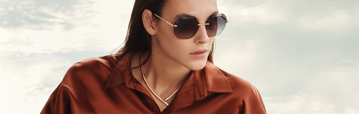 Model wearing the Serpenti Viper sunglasses with hexagonal lenses for the Bulgari eyewear campaign.