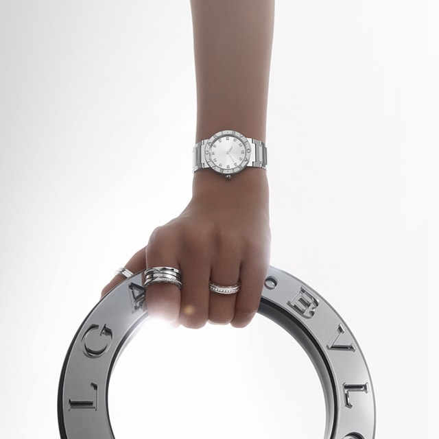 Model wearing Bvlgari Bvlgari watch and Bzero1 ring.