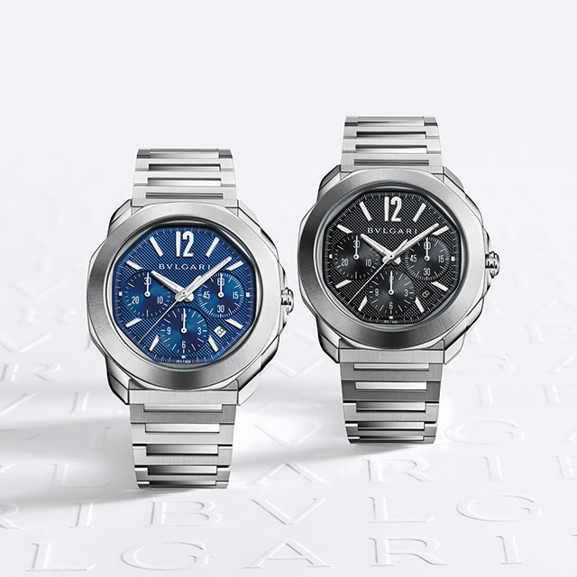 Octo Roma Chronograph stainless steel watches with blue and black dial, white Bulgari logo background.