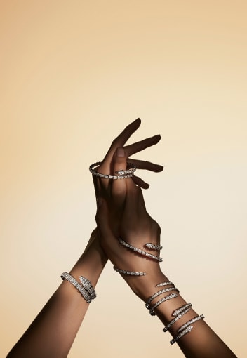 Model wearing Serpenti jewels. Creative shot of Serpenti 75 campaign.