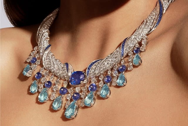 Model wearing the Mediterranean Muse Mediterranea High Jewelry platinum necklace with sapphires, aquamarines and diamonds, close-up.
