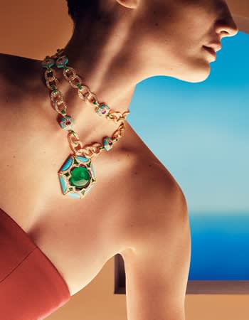 Model wearing Exedra Mediterranea High Jewelry yellow gold necklace with turquoise, amethysts and diamonds.