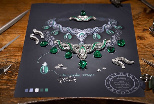 Makinf of Serpenti Baroque High Jewellery platinum necklace with emeralds and diamonds, close-up.