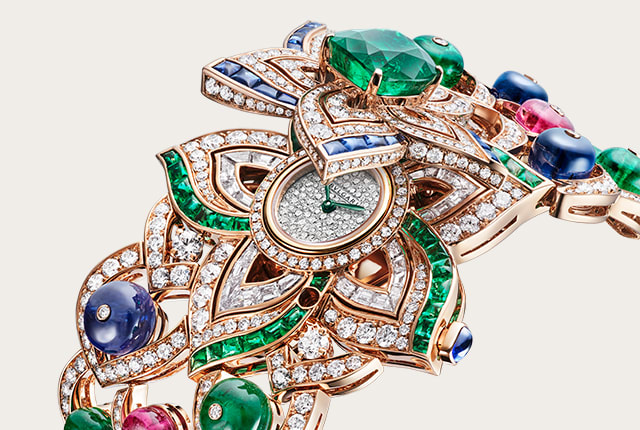 Oriental Buds High Jewelry secret watch with emeralds and diamonds. Pair with the Oriental Buds necklace. Full view.