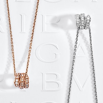 Serpenti Viper pendant necklaces set with pavé diamonds.
