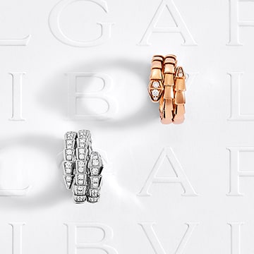 Serpenti Viper two-coil rings set with demi-pavé diamonds.