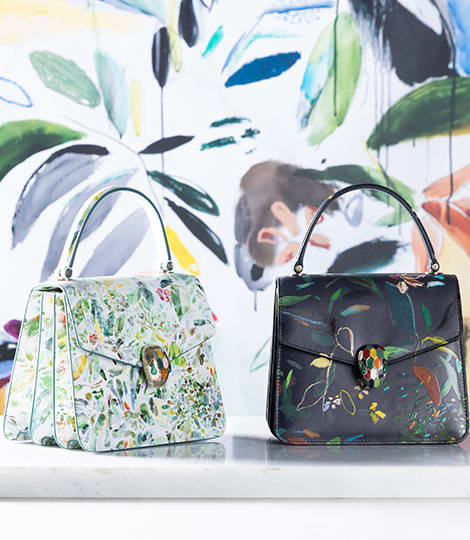 Serpenti Forever Top Handle bags in white and black calf leather with leaves motif, designed by artist Sophie Kitching.