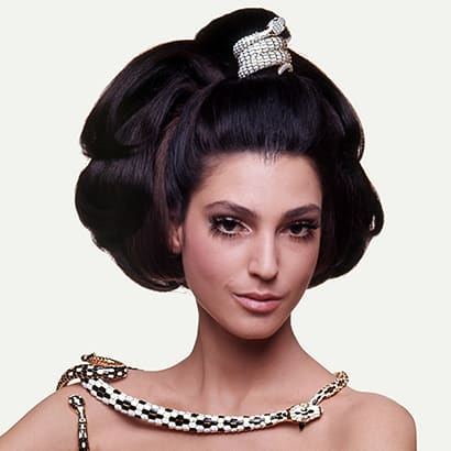 Model wearing a Bvlgari serpenti necklace.