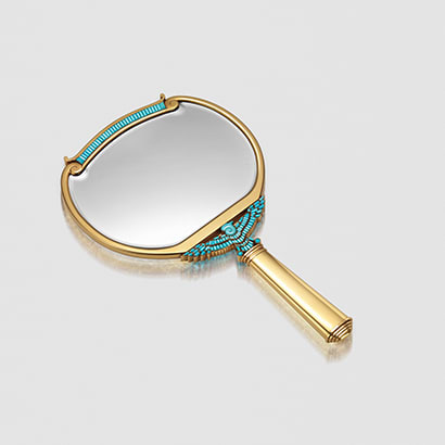 Mirror in gold with turquoise.