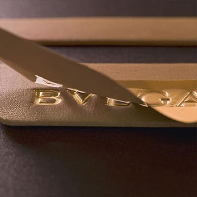 Making of the hot stamped Bulgari logo in gold symbolising Brand Protection.