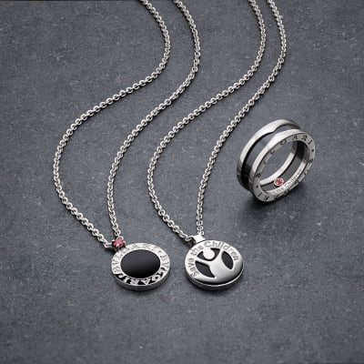 Bulgari x Save the Children pendant necklaces and ring in silver with black ceramic.