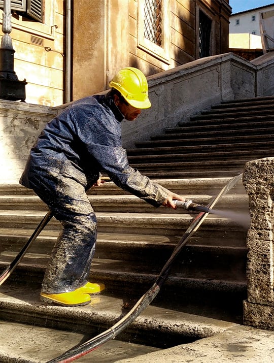 Man at work for the restoration of the Spanish Steps in Rome, financed by Bulgari as a patronage initiative.