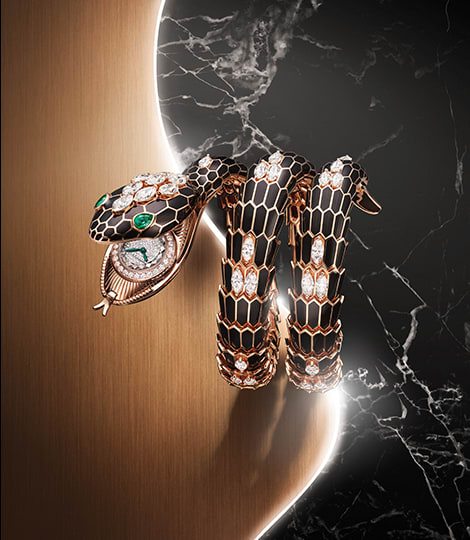 Serpenti Misteriosi High Jewelry rose gold secret watch with black lacquer and diamonds, creative shot.