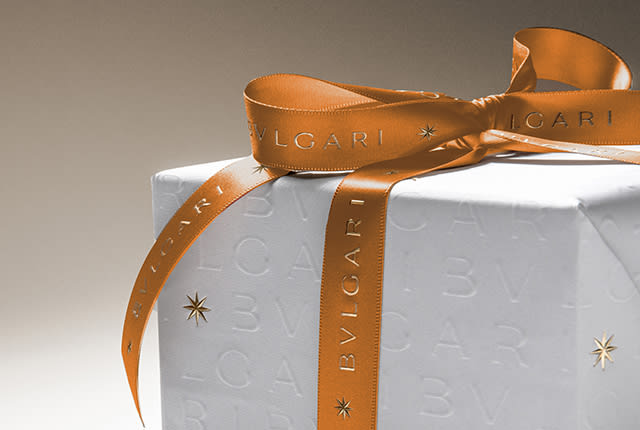 Bulgari gift boxes wrapped with the special white Holiday Season paper with Bulgari logo and ribbon.