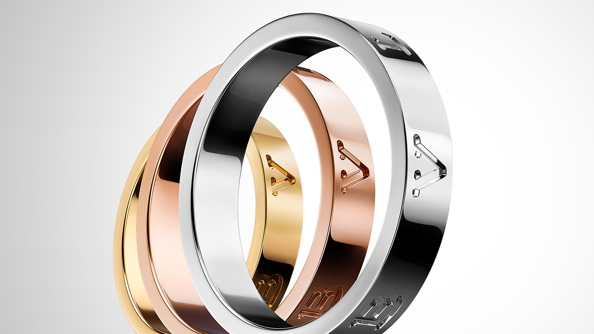 Bzero1 Essentials rings in rose, yellow and white gold.