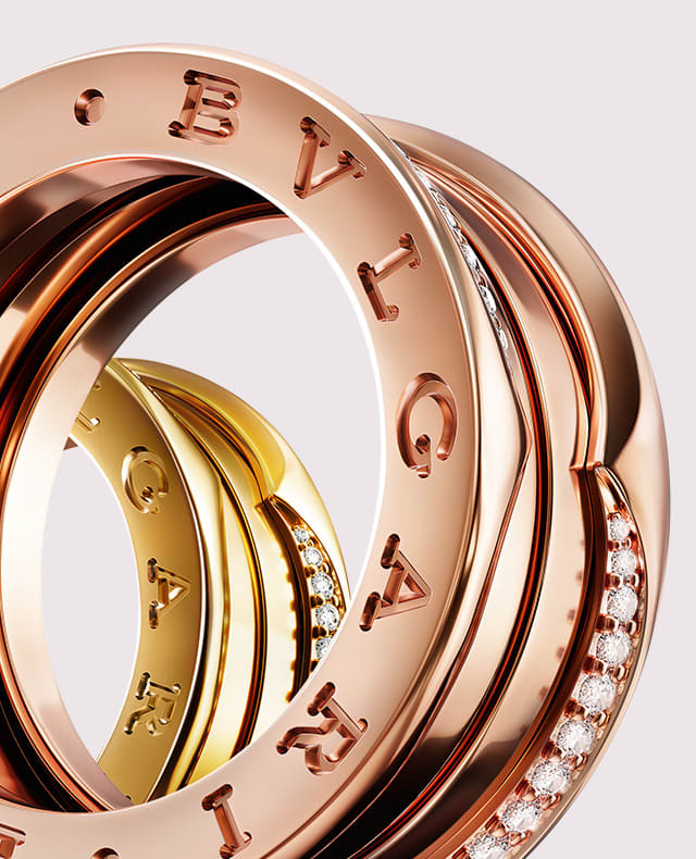Different iterations of B.zero1 and B.zero1 Rock rose or yellow gold rings with diamonds, close up.