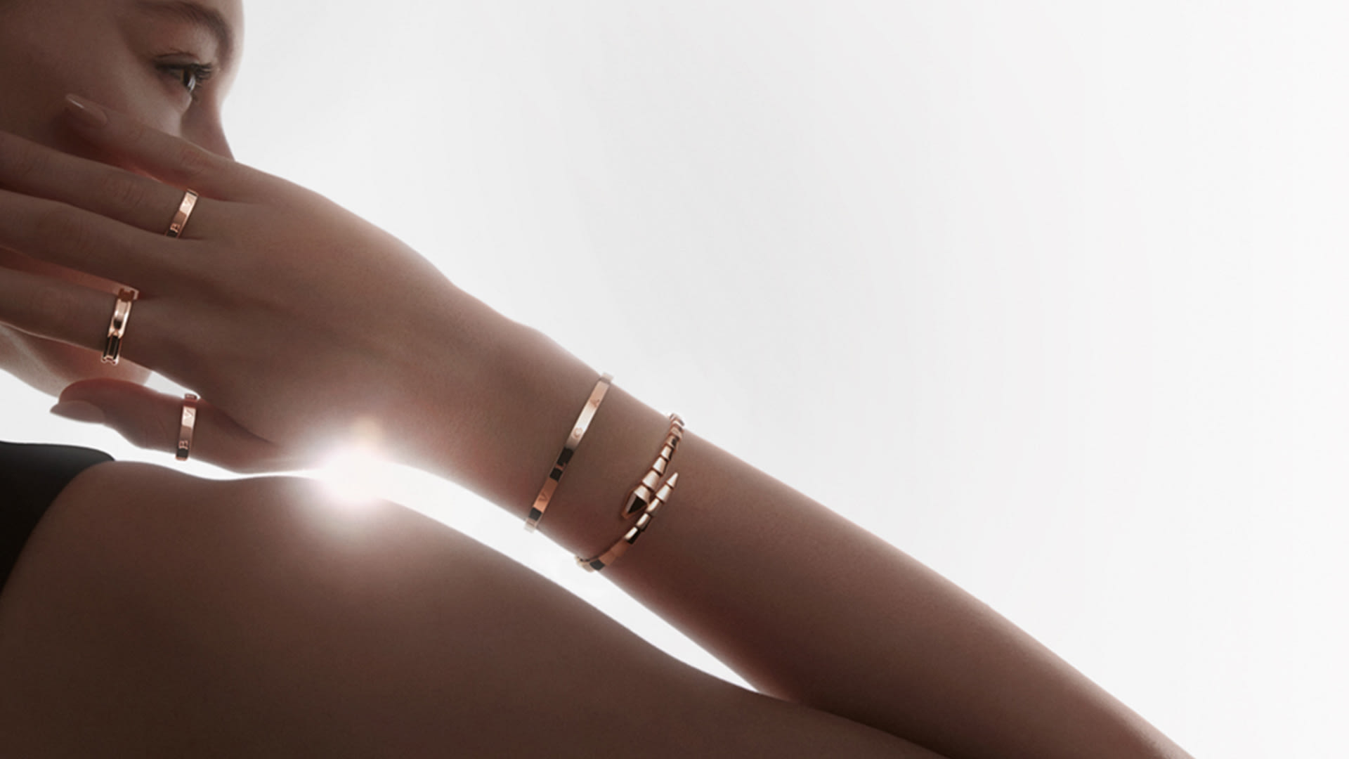 Model wearing Bzero1 bracelets and rings.