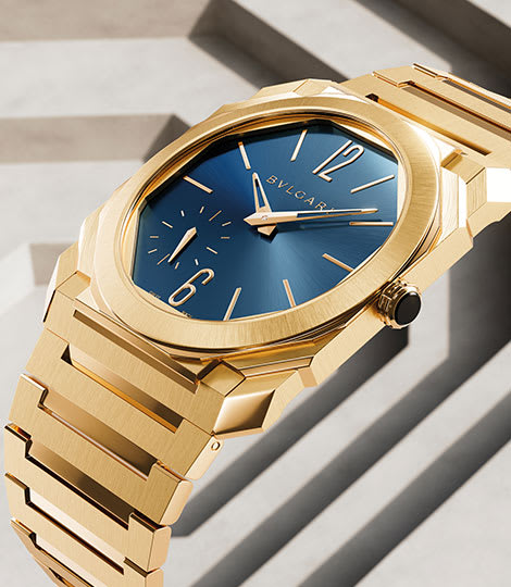 Octo Finissimo Automatic watch in yellow gold with blue lacquered dial, backdrop with octagonal motif.