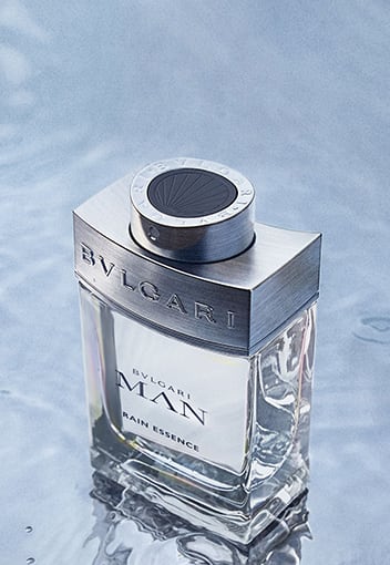 Bottle of the Bulgari Man Rain essence fragrance for men, creative close up shot.