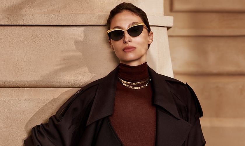 Model wearing Bvlgari Tubogas semi-rimless cat-eye sunglasses and Tubogas necklaces.