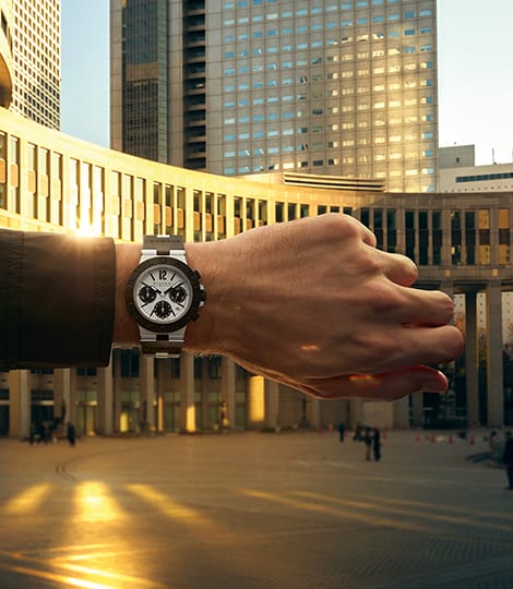 Bvlgari Aluminium GMT watch in aluminium and black rubber, departure board in the background, image 2