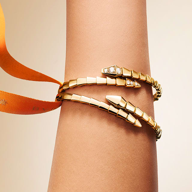 Bvlgari Serpenti bracelets, creative shot with ribbon.