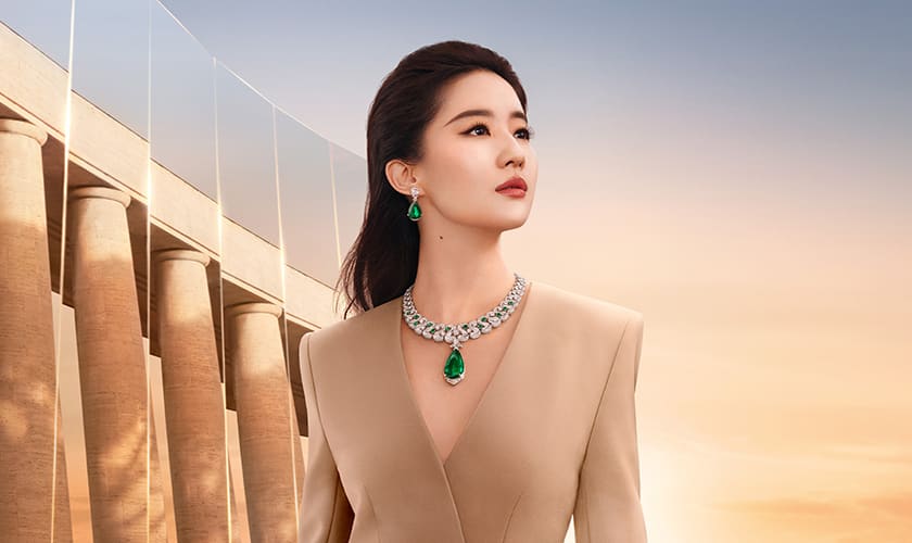 Liu Yifei wearing Bvlgari High Jewellery, dawn sky and Roman architecture in the background.