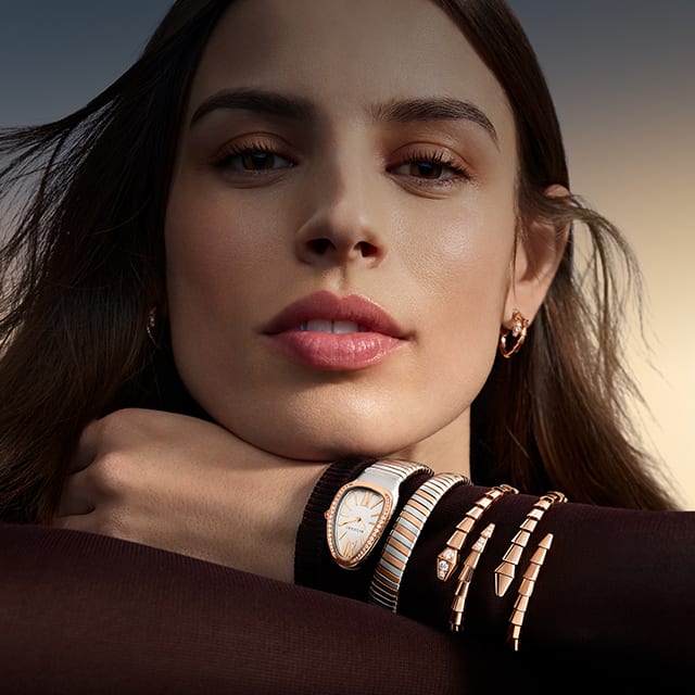 Model wearing serpenti tubogas watch and Serpenti bracelets, Magnificent Icons.