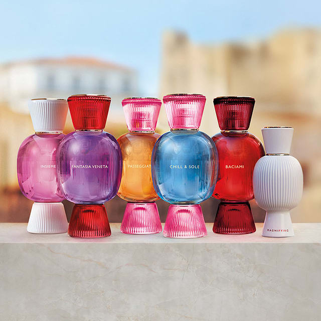 Five coloured glass bottles of the Bvlgari Allegra Eau the Parfum fragrance collection and one Bvlgari Allegra Magnifying essence white bottle.