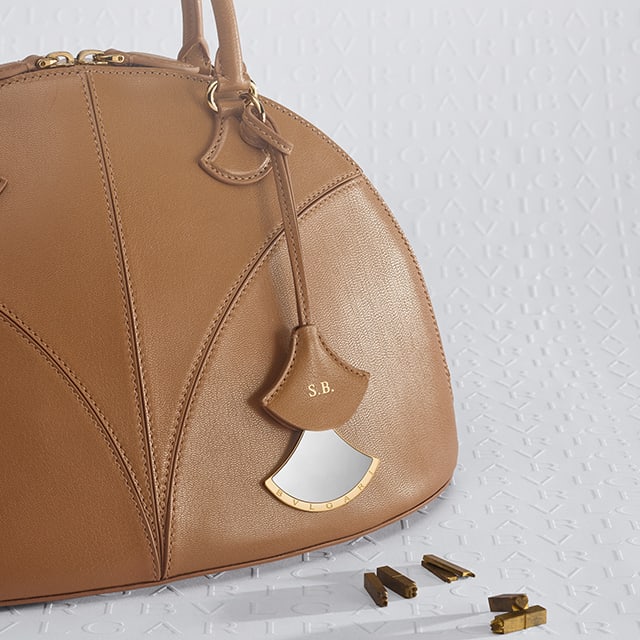 Marquise top handle bag in brown goat leather.