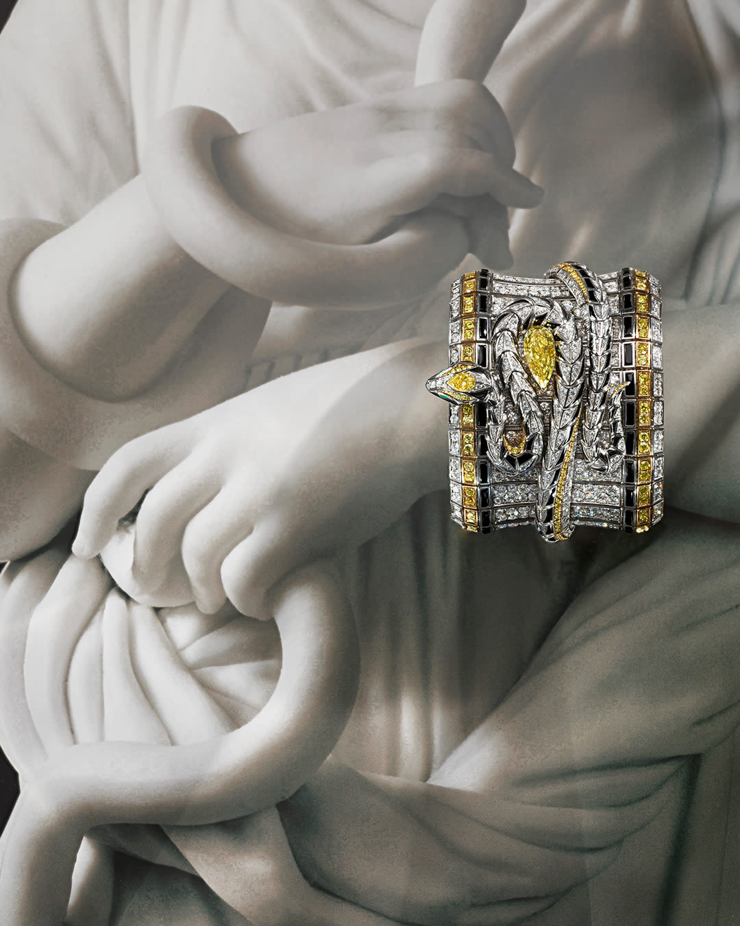 Serpenti Spira High Jewellery white gold cuff with yellow diamonds, onyx elements and diamonds.