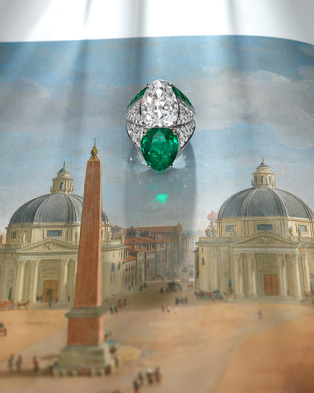 Incontro Segreto High Jewellery toi et moi ring in white gold with a pear-shaped diamond and emerald.
