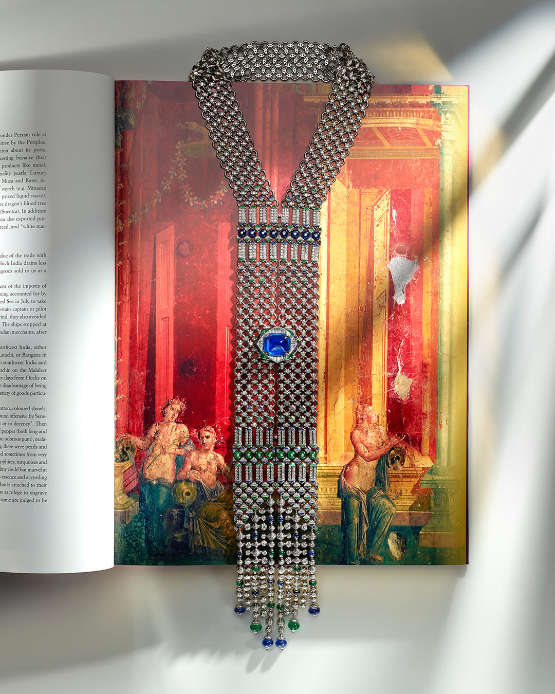 Seres Scarf High Jewellery white gold necklace set with a cushion sapphire, emeralds, sapphires and diamonds.