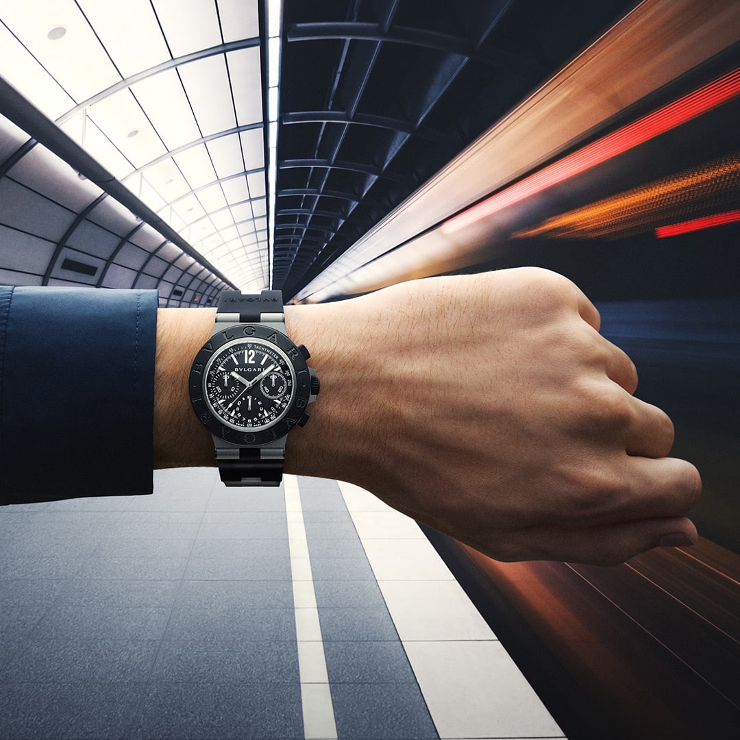 Bvlgari Titanio Chronograph watch in Grade 5 titanium worn on the wrist against a futuristic backdrop.