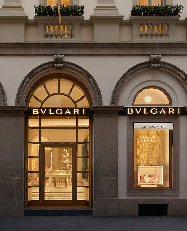 Facade of the Roman Bulgari store in via Condotti with central portal, side windows and Bulgari inscription.
