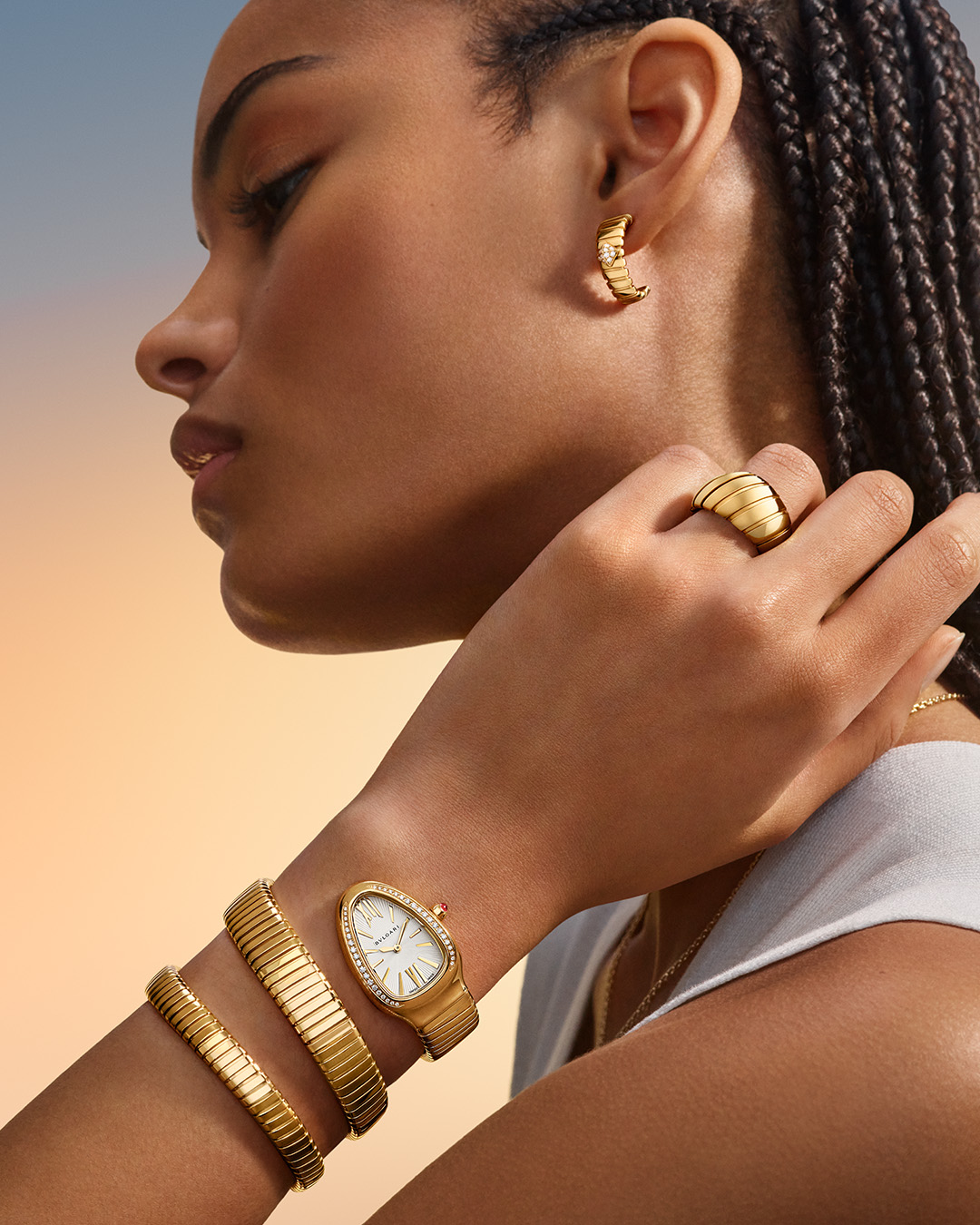 Model wearing Bvlgari Tubogas Jewellery and Serpenti Tubogas watch.